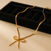 Elegant Gold-Tone Herringbone Bow Necklace – Minimalist Ribbon Design