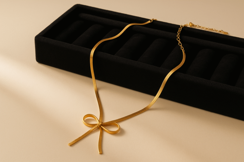 Elegant Gold-Tone Herringbone Bow Necklace – Minimalist Ribbon Design