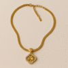 Golden Clover Charm Necklace – Luxe Chain with Crystal-Studded Floral Pendant