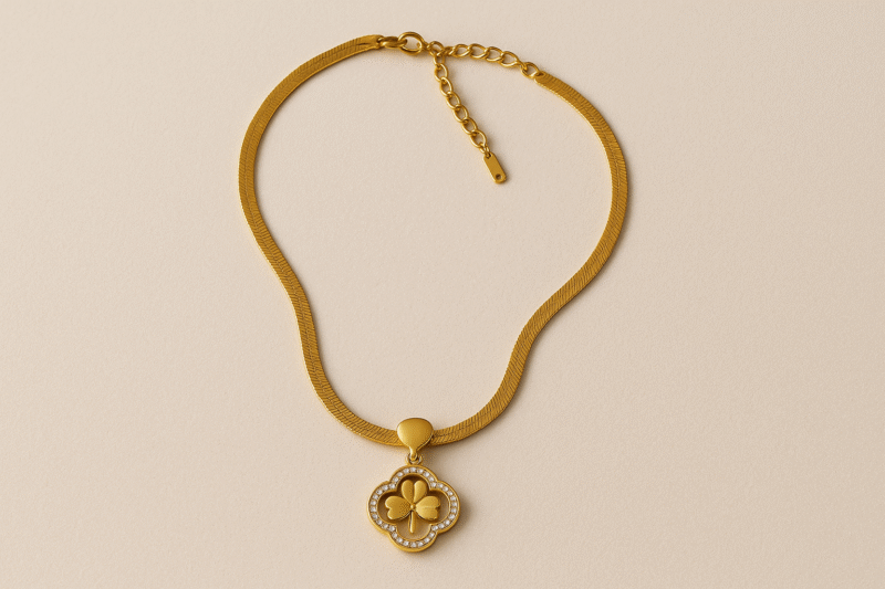 Golden Clover Charm Necklace – Luxe Chain with Crystal-Studded Floral Pendant