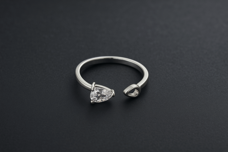 Teardrop Elegance Ring – Adjustable Silver Band with Pear-Cut Center Stone Accent